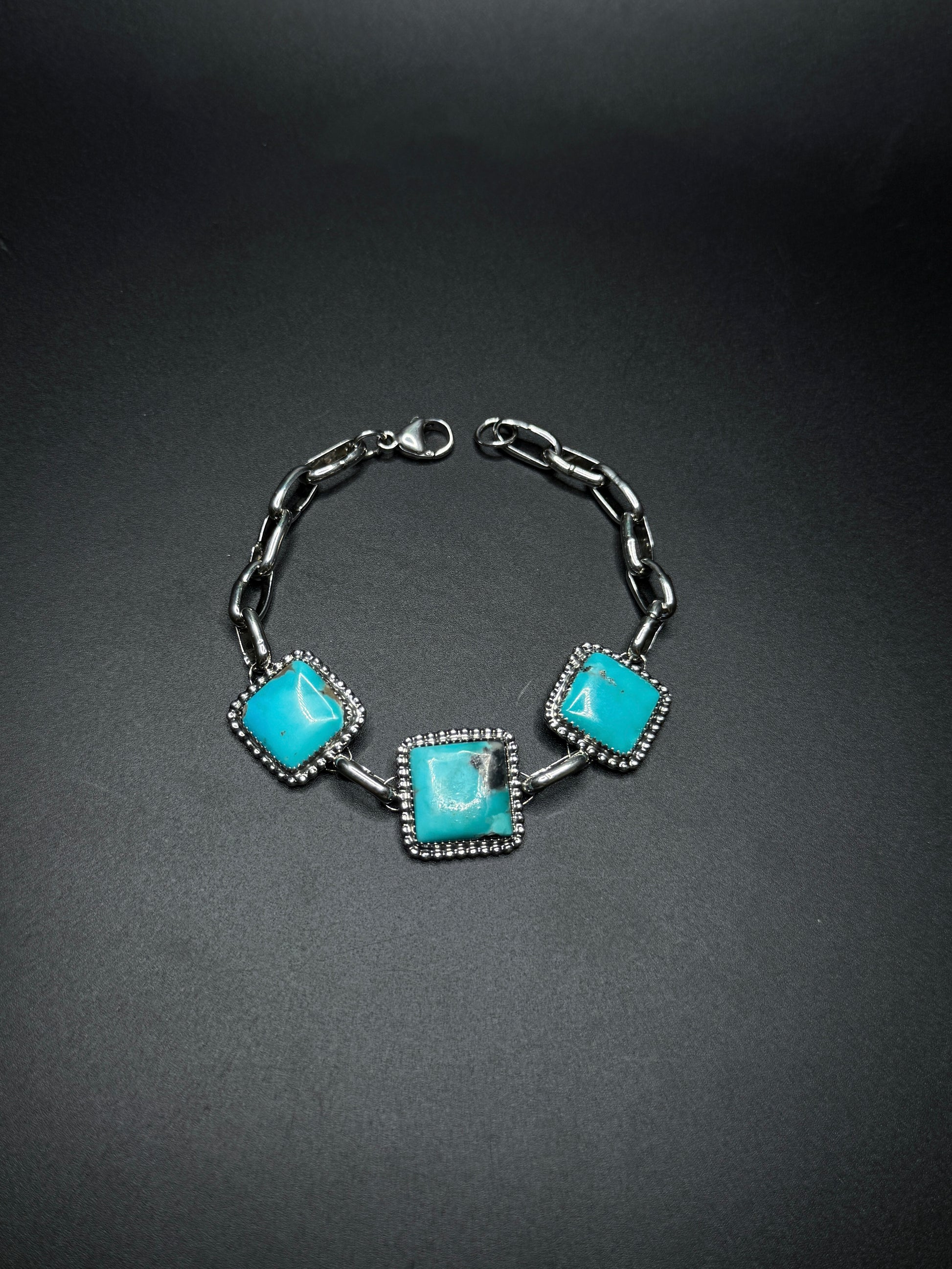 Bracelet with turquoise stones on a dark background