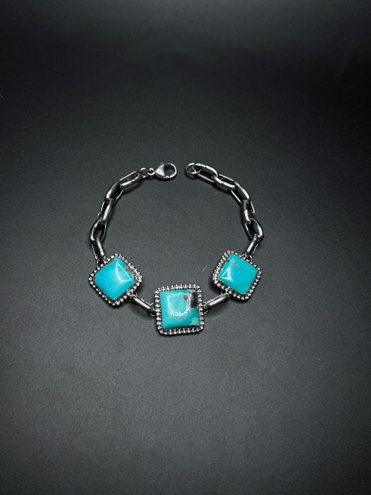 Bracelet with turquoise stones on a dark background