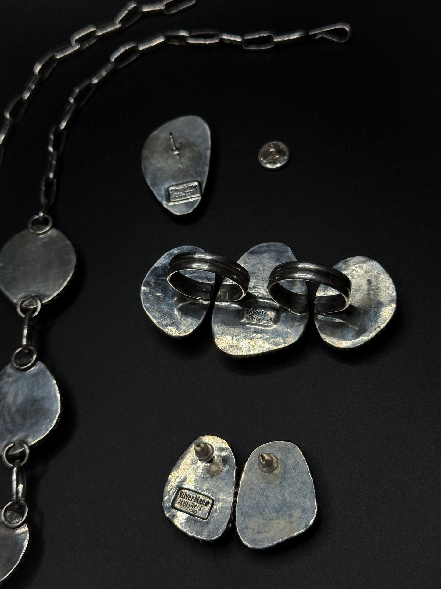 The back plate stamping for the earrings, ring, and pin