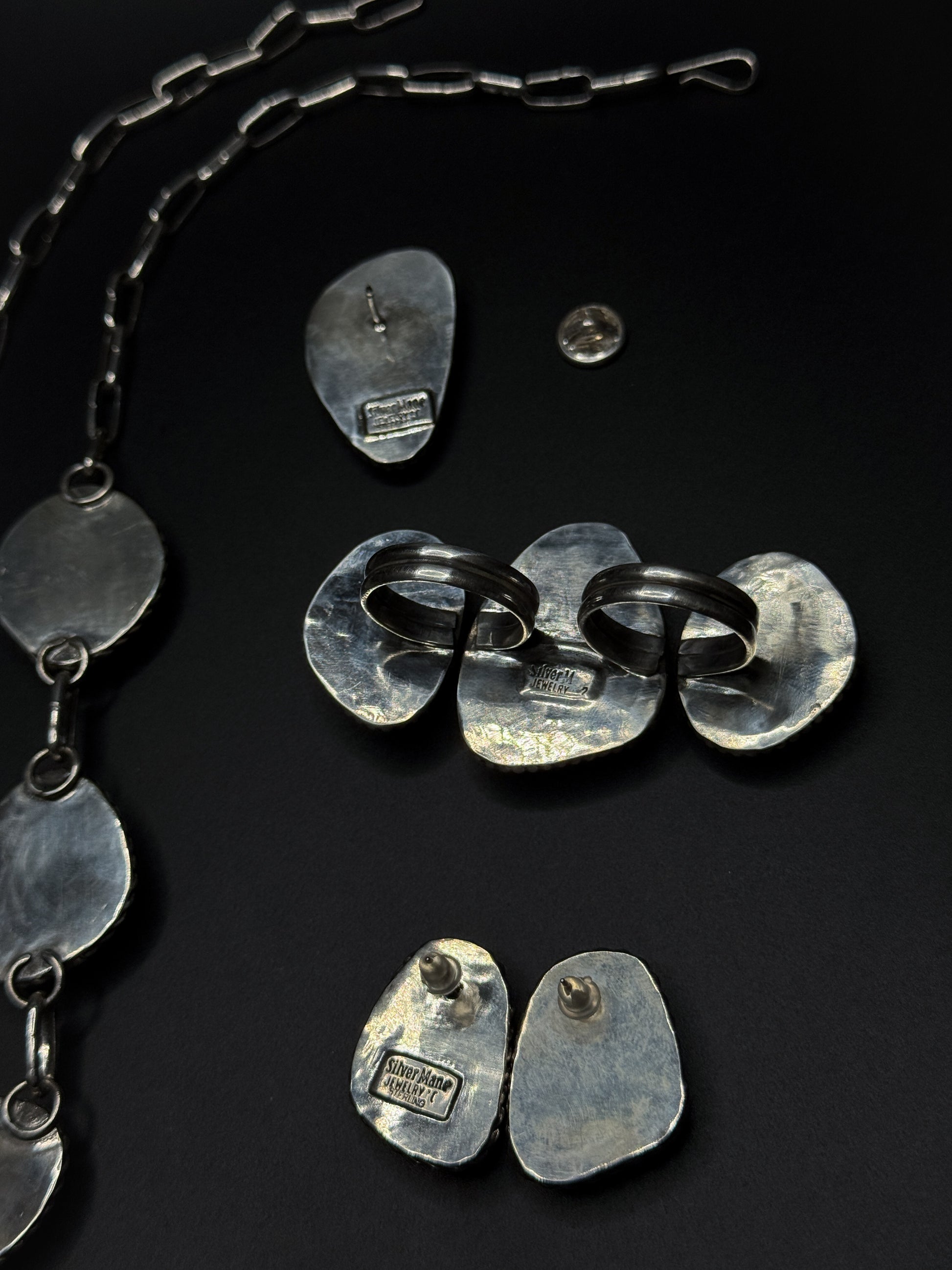 The back plate stamping for the earrings, ring, and pin