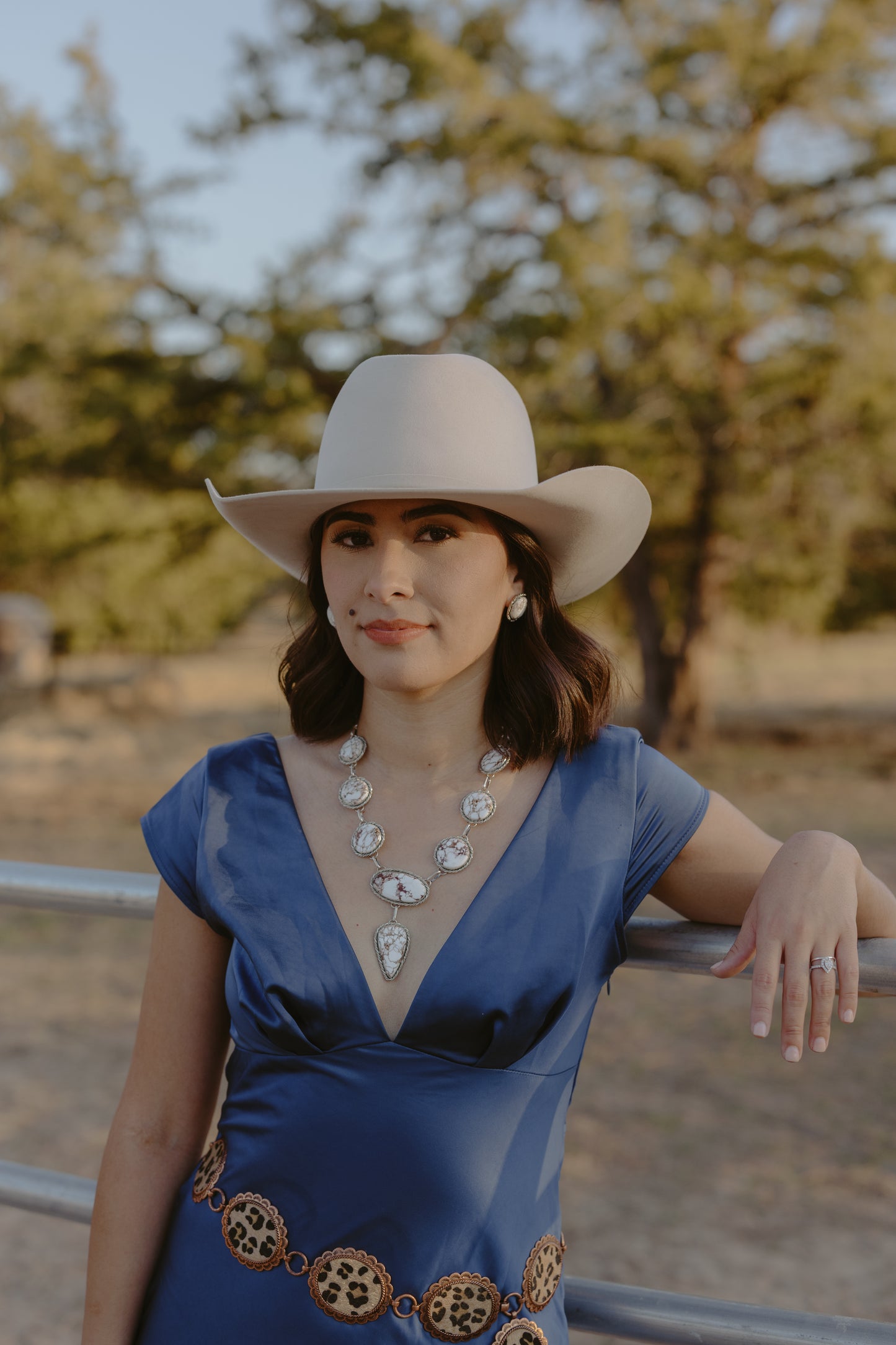 wild horse necklace and earrings on model